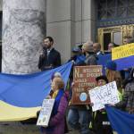 Rep. Zack Fields, D-Anchorage speaks during a rally urging the Alaska government, particularly the Permanent Fund Corp., to divest itself from any Russian investment. Legislation to require divestment did not pass the Legislature. The state still holds millions of dollars in Russian investments. (Peter Segall / Juneau Empire File)