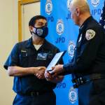 Michael S. Lockett / Juneau Empire 
Chief Ed Mercer presents Juneau Police Department employee Oscar Godinez with the Citizen of the Year award for the department during annual award ceremony on June 9, 2022.