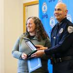 Michael S. Lockett / Juneau Empire 
Chief Ed Mercer presents community service officer Sarah Dolan with the Jackie Renninger Community Policing Award during the Juneau Police Departments annual award ceremony on June 9, 2022.