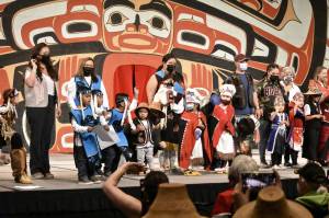 Performers and their families wave to the crowd at the end of the Toddler Regalia Review at Centennial Hall on Friday, June 10, 2022, part of Celebration 2022. Performers were aged 2-5, and wore regalia made for them by friends and family. (Peter Segall / Juneau Empire)