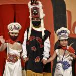 From left to right, Saige Jack, with cousins Zayn and Blake Johnson, show off their regalia - a mix of Tlingit and Athabascan pieces - during the Toddler Regalia Review at Centennial Hall on Friday, June 10, 2022. (Peter Segall / Juneau Empire)