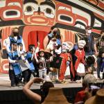 Performers and their families wave to the crowd at the end of the Toddler Regalia Review at Centennial Hall on Friday, June 10, 2022, part of Celebration 2022. Performers were aged 2-5, and wore regalia made for them by friends and family. (Peter Segall / Juneau Empire)