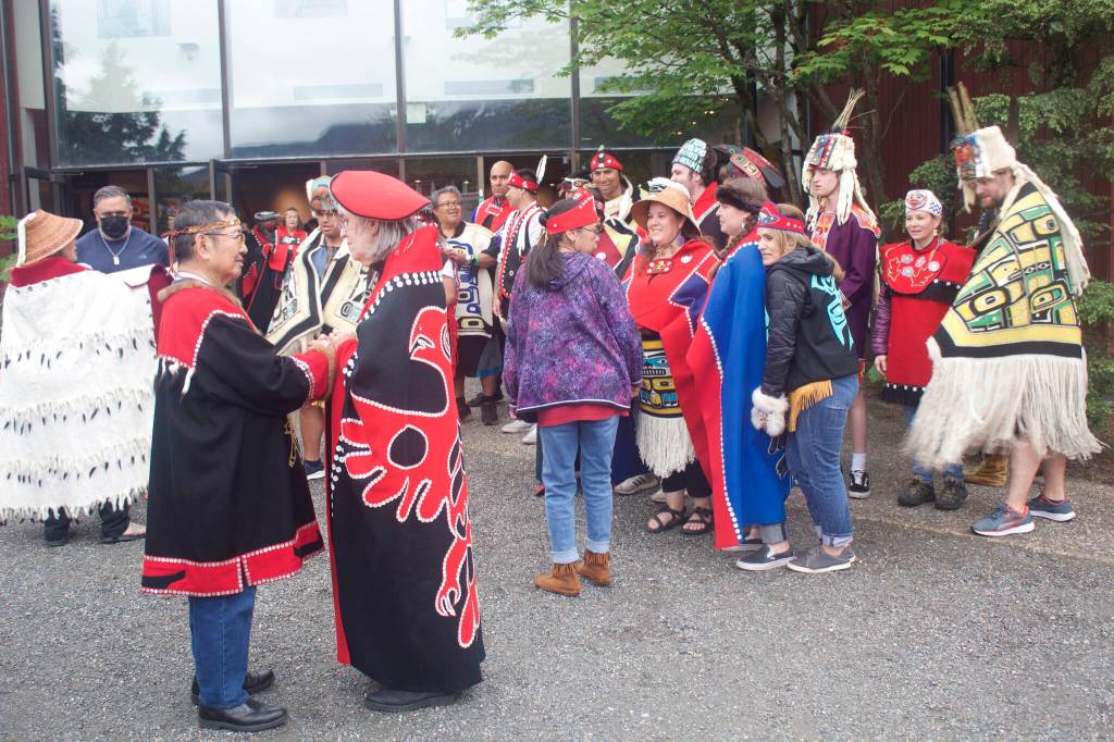 Barbara Searls, a Juneau resident and Celebration participant since 1992, exchanges farewells with Alaska Native Brotherhood/Sisterhood Grand President Marcelo Quinto after they make their Grand Exit from Centennial Hall on the final day of Celebration. (Mark Sabbatini / Juneau Empire)