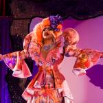Gigi Monroe welcomes guests to Glitz at Centennial Hall, a major annual drag event celebrated every Pride Month, on June 18, 2022. (Michael S. Lockett / Juneau Empire)