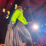 Tenderoni, one of the headliners, tosses off some of the dollar bills handed to them during Glitz, a major annual drag event celebrated every Pride Month, at Centennial Hall on June 18, 2022. (Michael S. Lockett / Juneau Empire)