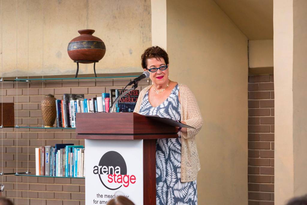 Molly Smith takes a turn at the lectern during an 11-hour reading of the Mueller report by more than 200 volunteers at Arena Stage in 2019. (Courtesy Photo / Arena Stage)