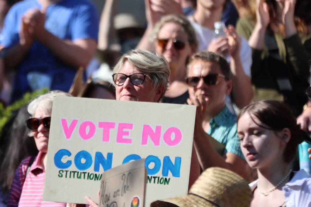 Former Democratic state Rep. Beth Kerttula holds up a sign reading Vote No Con Con, during a Saturday rally at the Dimond Courthouse Plaza in Juneau. Opposition to a constitutional convention, which could alter the Alaska State Constitution to allow for a statewide abortion ban was a frequent topic during the protest. (Ben Hohenstatt / Juneau Empire)