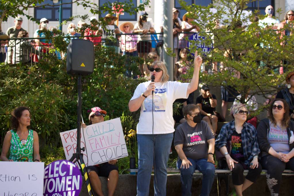 State Rep. Sara Hannan, D-Juneau, speaks to the large crowd as a part of the speeches lined up during the protest. The protest is in light of the recent reversal of Roe v. Wade, which granted constitutional protections for abortion. (Clarise Larson / Juneau Empire)