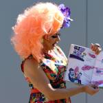 Drag queen Gigi Monroe reads a book about a wig during Drag Storytime at the Mendenhall Valley Public Library. (Ben Hohenstatt / Juneau Empire)