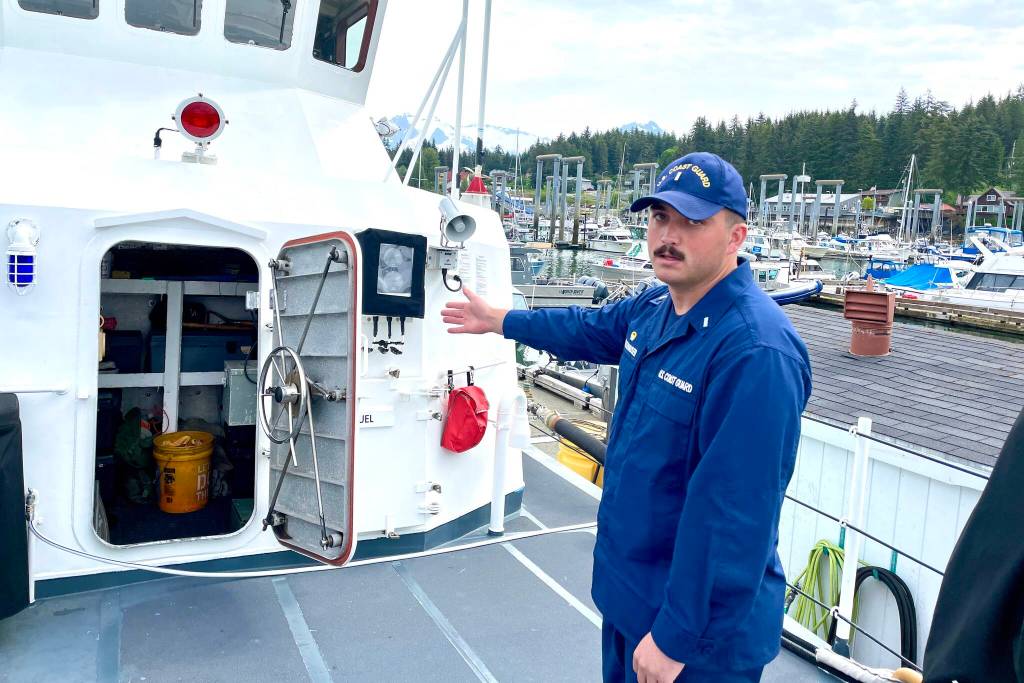 Lt. j.g. Kane Alletzhauser, commanding officer of the U.S. The U.S. Coast Guard Cutter Reef Shark, points out the damage control locker aboard the patrol vessel on June 29, 2022. (Michael S. Lockett / Juneau Empire)