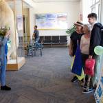 Mark Sabbatini / Juneau Empire 
Iryna Hrynchenko takes a photo of Bridget Smith, Joyanne Bloom and Hrynchenkos 18-year-old son Ivan inside Juneau International Airport on Saturday.