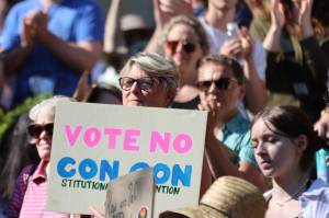 Former Democratic state Rep. Beth Kerttula holds up a sign reading Vote No Con Con, during a recent rally at the Dimond Courthouse Plaza in Juneau. Opposition to a constitutional convention, which could alter the Alaska State Constitution to allow for banning abortions was a frequent topic during the protest. (Ben Hohenstatt / Juneau Empire File)