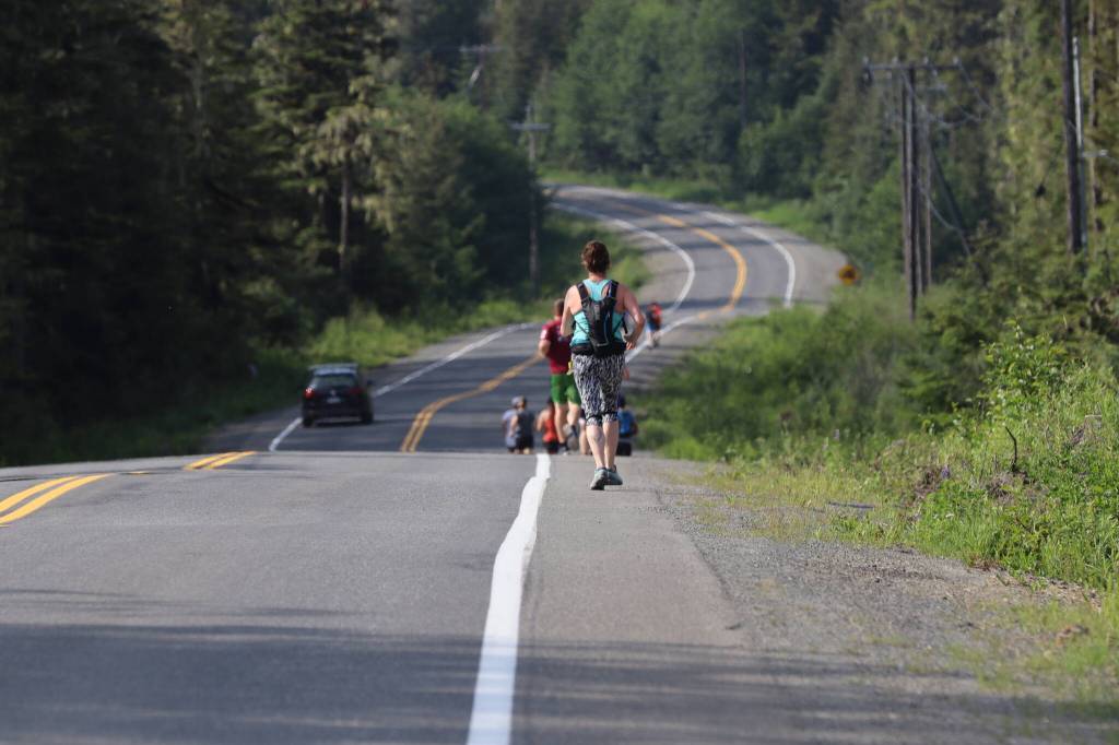 Runners pound up Fish Creek Road towards the ski area during the Eaglecrest Road and Ridge Race on July 2, 2022. (Michael S. Lockett / Juneau Empire)