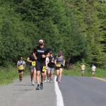 Runners pound up Fish Creek Road towards the ski area during the Eaglecrest Road and Ridge Race on July 2, 2022. (Michael S. Lockett / Juneau Empire)