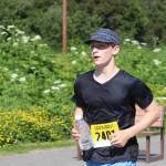Erik Thompson, who placed first in the five-mile portion of the Eaglecrest Road and Ridge Race races in to the finish in the ski areas parking lot on July 2, 2022. (Michael S. Lockett / Juneau Empire)