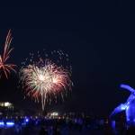Locals gathered for a whale of a time near Tahku, the Alaska Whale Sculpture under shimmering lights and loud booms for the annual firework display over Gastineau Channel. (Clarise Larson / Juneau Empire)