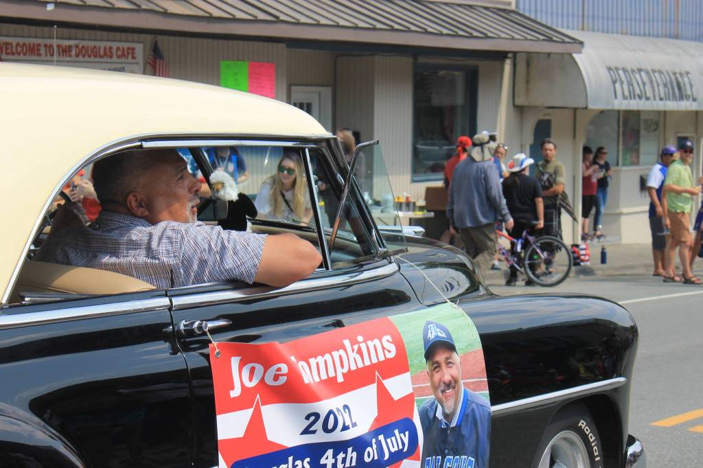 Award-winning USA Paralympic Skier Joe Tompkins leads the start of the parade as the 2022 Grand Marshal. (Clarise Larson / Juneau Empire)