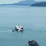 A Coast Guard aircrew and a Good Samaritan vessel rescued four mariners after their boat capsized in Glacier Bay National Park, Alaska, July 1, 2022. (Courtesy photo / USCG)