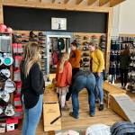 Jonson Kuhn / Juneau Empire
Foggy Mountain Shop co-owner Courtney Nicholl helps customers find all of their outdoor gear and accessories at new location.
