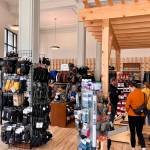 Foggy Mountain Shop co-owner Sean Rielly greets customers in new location. (Jonson Kuhn / Juneau Empire)
