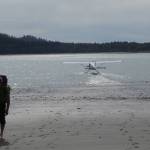Dan Mann walks from a float plane in Anchorage Cove of Lituya Bay in Southeast Alaska. The pilot had just dropped him off for a 12-day trip. (Courtesy Photo / Ned Rozell)