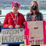 Dawn Sexton with her granddaughter Cora Hoyt showing their support of pro-abortion on Saturdays rally. (Jonson Kuhn / Juneau Empire)
