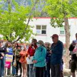 People gathered at rally listening to key note speakers with signs proudly displayed in support of pro-abortion rights. (Jonson Kuhn / Juneau Empire)