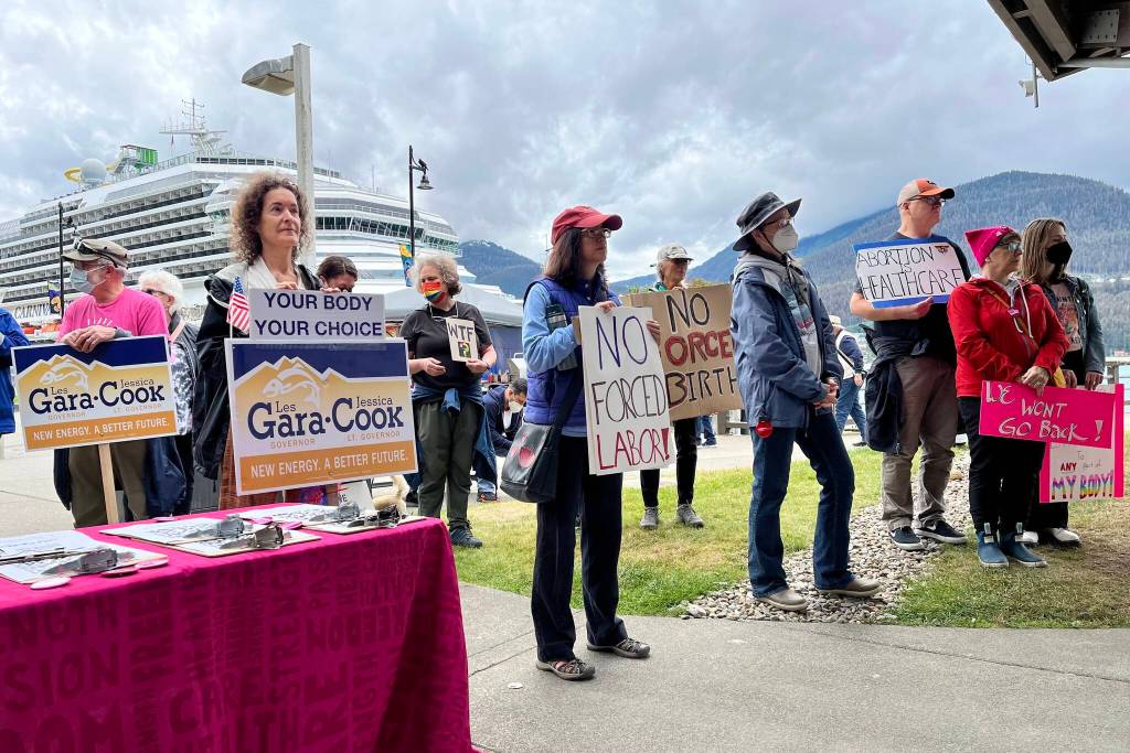 Crowd holding signs and showing solidarity at Saturdays rally. (Jonson Kuhn / Juneau Empire)