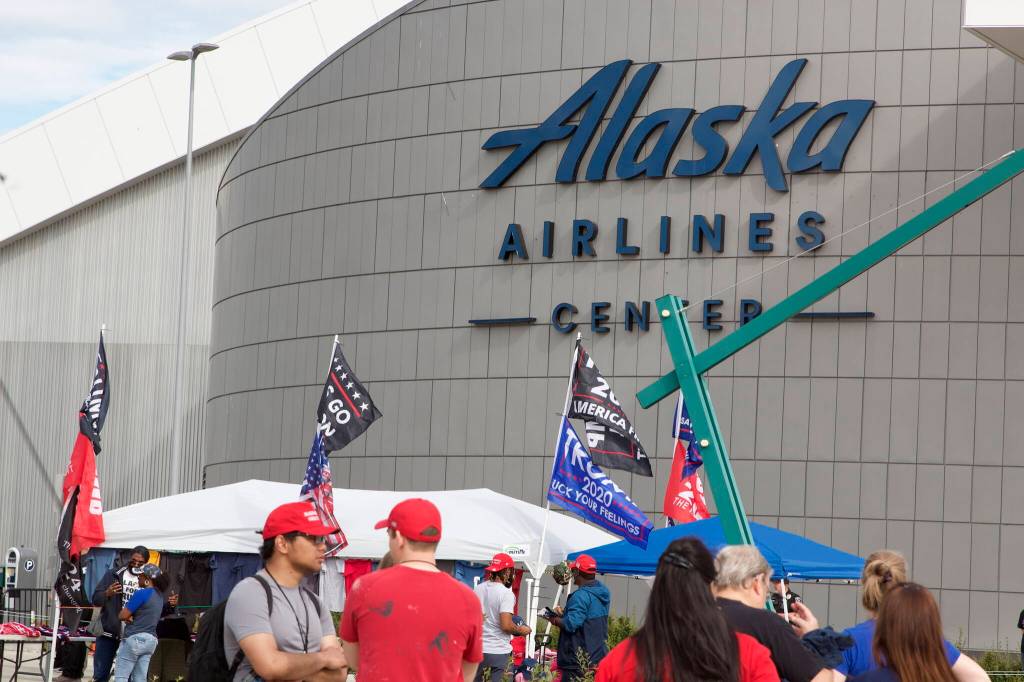 Flags, including one bannering profanity, fly in the morning breeze near the entrance of the Save America Rally at the Alaska Airlines Center on Saturday. (Mark Sabbatini / Juneau Empire)
Flags, including one bannering profanity, fly in the morning breeze near the entrance of the Save America Rally at the Alaska Airlines Center on Saturday. (Mark Sabbatini / Juneau Empire)