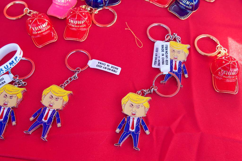 Trump pins with Made in China tags are displayed on a vendor table at the Save America Rally on Saturday. The manager of the merchandise says virtually everything else is made in the United States. (Mark Sabbatini / Juneau Empire)
