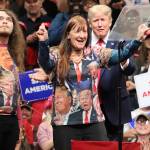 Mark Sabbatini / Juneau Empire 
Garrett Graham and Saundra Kiczenski are called to the stage by former President Donald Trump after he spotted them wearing T-shirts with his likeness among the front row of spectators at the Save America rally on Saturday in Anchorage. Kiczenski, a Michigan resident who said shes attended 64 Trump rallies since Dec. 21, 2015, wrote a book about her experiences and previously met him when she paid to get into a fundraiser to ask his opinion about it. Graham has also attended numerous Trump rallies across the country.