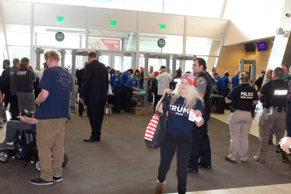 People pass through a U.S. Secret Service security check upon entering the Alaska Airlines Center for Saturdays rally. The photographer was sent away from the entrance by a rally media official shortly after this picture was taken. (Mark Sabbatini / Juneau Empire)