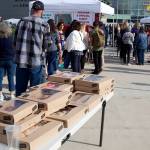 Not only could people skip the hours-long waiting line for free admission to the rally by signing up as volunteers on the spot, they got free donuts as well. (Mark Sabbatini / Juneau Empire)