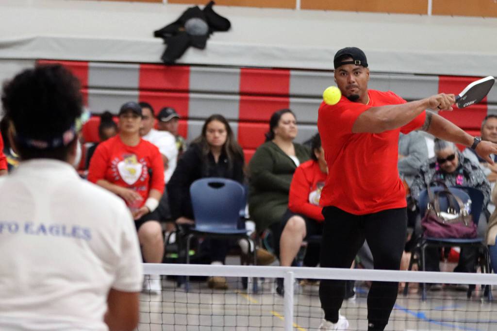 Stephen Paea sends a pickleball over the net Saturday at Floyd Dryden Middle School. Paea and wife, Vika Toetuu Paea, claimed the top spot in the tournaments advanced mixed division. (Ben Hohenstatt / Juneau Empire)