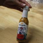 Barnacle Foods co-founder Lia Heifetz shows off a sauce made by the company. (Clarise Larson / Juneau Empire)