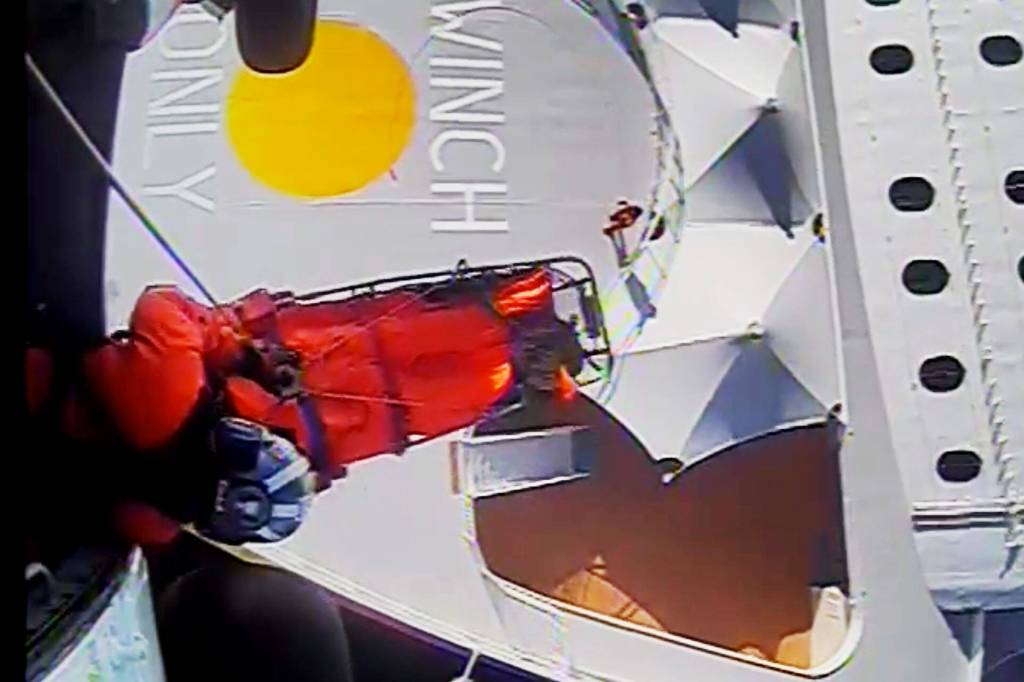 An MH-60 Jayhawk crew chief from Coast Guard Air Station Sitka hoists a casualty from the Norwegian Princess while underway in the Chatham Strait on July 18, 2020. (Screenshot)