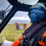 A Coast Guard Air Station Kodiak MH-60 Jayhawk helicopter pilot watches as the aircrew assists overdue boaters, July 18, 2022. (Lt. Scott Kellerman / U.S. Coast Guard)