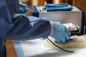 Donated blood is prepared for storage and eventual transport at the Blood Bank of Alaska's Juneau location. There is a statewide shortage of donated blood. (Ben Hohenstatt / Juneau Empire)