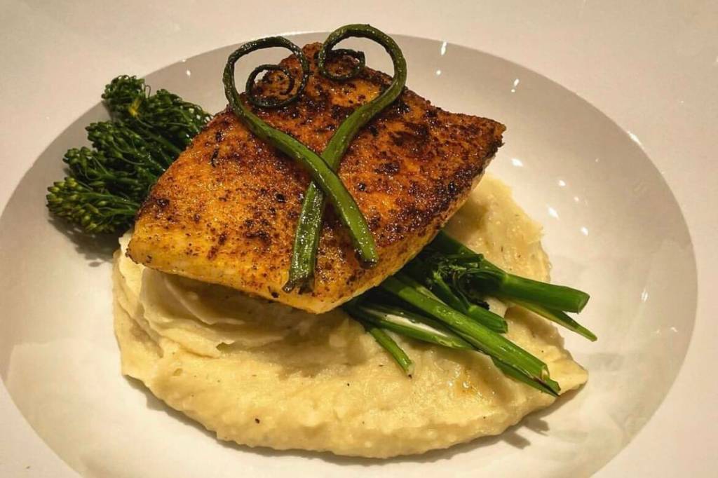 Wild Alaskan Halibut with mashers and foraged wild Alaskan fiddle heads featured at the Jorgenson House and prepared by Chef Enciso. (Courtesy photo / Brava Food)