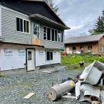 Mucked-out debris sits out back of a house that Team Rubicon, a disaster-recovery nonprofit, is helping to restore following Haines 2020 landslides. (Michael S. Lockett / Juneau Empire)