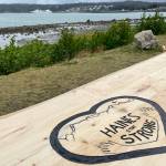 A recently-installed table memorializes the losses from the 2020 landslides in Haines, visible in the background (Michael S. Lockett / Juneau Empire)