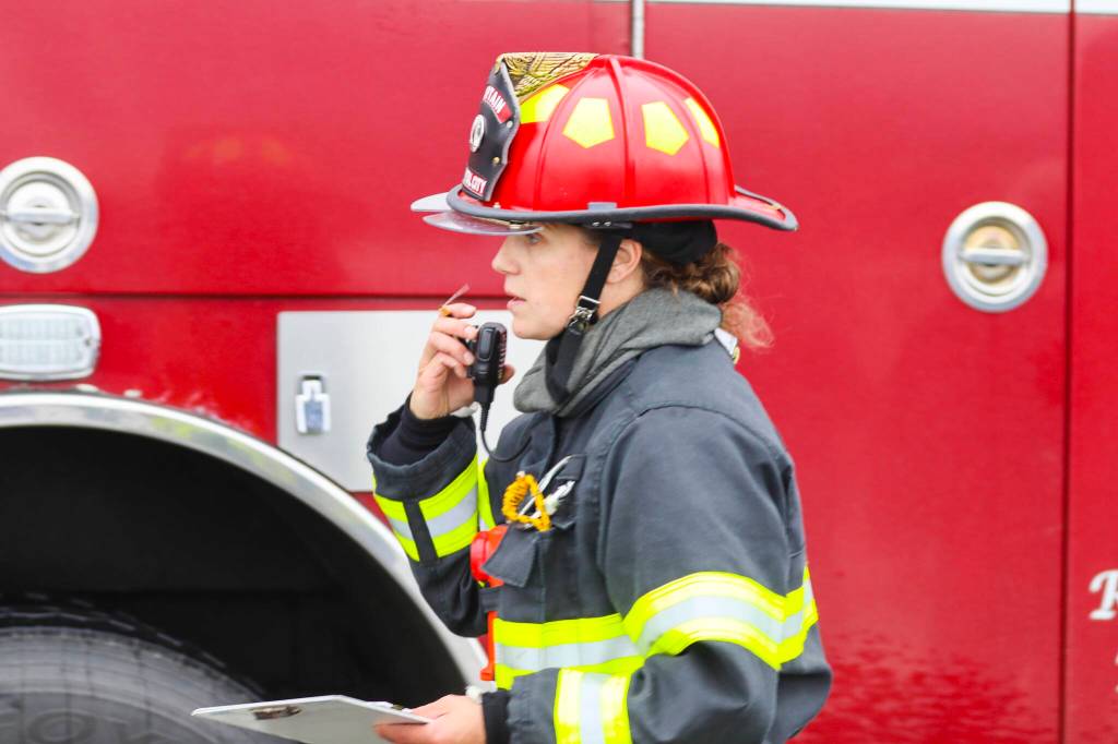 Capt. Anne Wilcock of Capital City Fire/Rescue coordinates the departments response to a simulated airplane crash during an exercise at Juneau International Airport on July 23, 2022. (Michael S. Lockett / Juneau Empire)