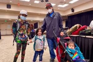 Students show off their new backpacks at Central Council of the Tlingit and Haida Indian Tribes of Alaskas annual backpack distribution at Elizabeth Peratrovich Hall on July 23, 2022. (Michael S. Lockett / Juneau Empire)