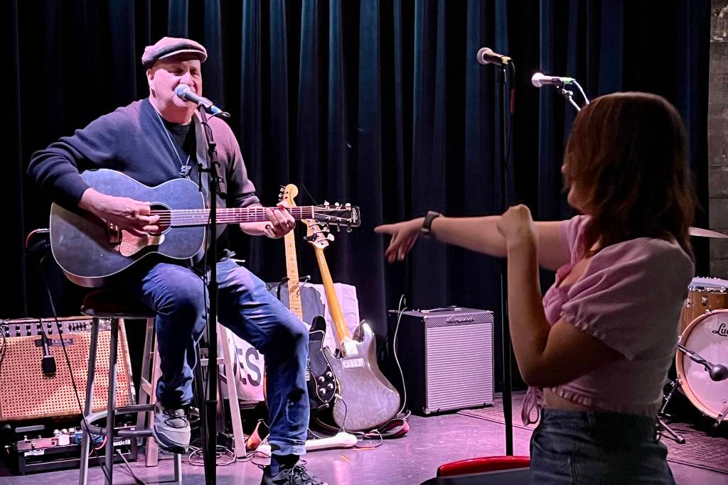 Keith Scott attracted many fans with his performance at the Crystal Saloon, including visiting tourist Astrid Harris. (Jonson Kuhn / Juneau Empire)