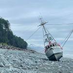 A Coast Guard aircrew fro Coast Guard Air Station Sitka rescued a boats captain after his vessel ran aground southeast of Yakutat on Thursday morning. (Courtesy photo / USCG)