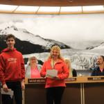 Ivan and Iryna Hrynchenko give a short speech at the City Borough of Juneau Assembly meeting Monday night. The mother and son duo are the first refugees from the war in Ukraine to be welcomed to the capital city after their hometown suffered Russian attacks and forced them to flee. (Clarise Larson / Juneau Empire)