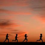 High school students run at sunset as they practice for the track and field season Monday, Feb. 28, 2022, in Shawnee, Kan. New research hints that even simple exercise just might help fend off memory problems. While physical activity helps keep healthy brains fit, it's not clear how much it helps once memory starts to slide.  (AP Photo / Charlie Riedel)