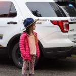 Emily Gouk trying on Alaska State Trooper hat at Juneaus 14th annual National Night Out. A main focus of the national event is community engagement, but especially amongst children. Photo taken on Skywood Lane. (Jonson Kuhn / Juneau Empire)