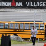 Jeff Rogers, the City and Borough of Juneaus financial director, heads to the Ironman Village at Thunder Mountain High School on Thursday afternoon to attend the athlete briefing event. (Ben Hohenstatt / Juneau Empire)