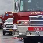Capital City Fire/Rescue vehicles form a line at Juneau International Airport for a drill. (Ben Hohenstatt / Juneau Empire File)